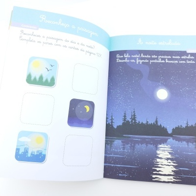 Livro aberto com ilustrações do dia e da noite e texto em português