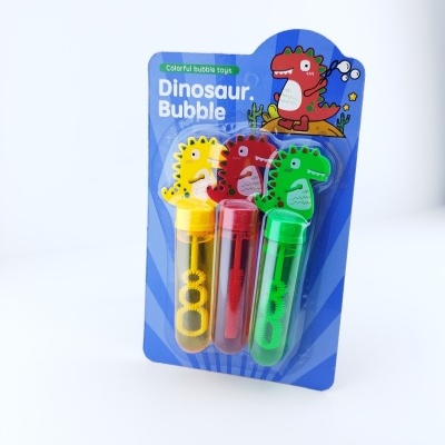 Conjunto de três bolhas de sabão coloridas com dinossauros em embalagem azul