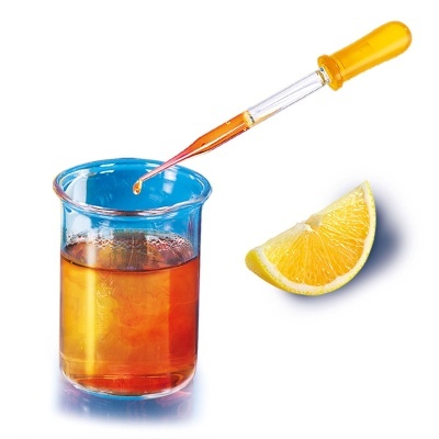 Frasco com líquido âmbar e conta-gotas laranja ao lado de uma fatia de limão