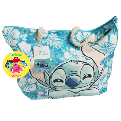Mala azul com padrão floral branco e Stitch da Disney, alças de corda e etiqueta Disney CLASSICS.
