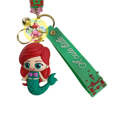 Porta-chaves com figura de sereia e tira verde com texto