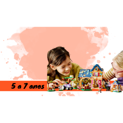 Crianças a brincar com blocos de construção e uma casa LEGO colorida