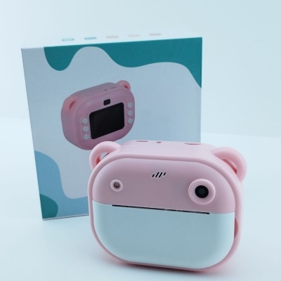 Máquina fotográfica digital para crianças rosa e branco com formato de urso e embalagem azul e branco