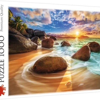 Caixa de puzzle Trefl com imagem de praia e rochas ao pôr do sol