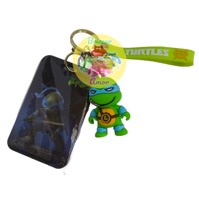 Porta-chaves com figura de tartaruga ninja e tira verde com texto TURTLES