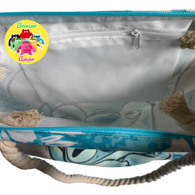 Interior de bolsa azul com padrão floral e bolso com fecho