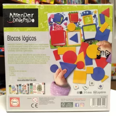 Caixa do jogo Blocos Lógicos com peças coloridas e instruções em português.