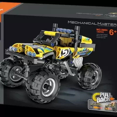 Caixa preta contendo brinquedo de construção de carro todo-terreno amarelo e preto com rodas grandes