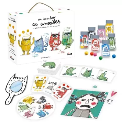 Jogo educativo eu descubro as emoções com cartas, peças ilustradas, frascos com bolas coloridas e caixa com ilustrações de monstros.