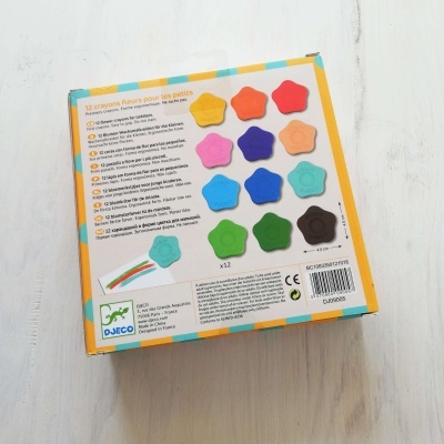 Caixa do jogo com flores coloridas da Djeco e texto em francês no verso.