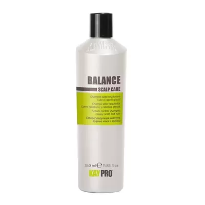 Frasco branco de shampoo KAYPRO com rótulo verde e tampa preta