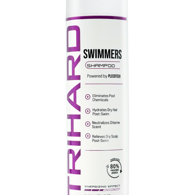 Frasco branco de champô Trihard Swimmers com texto em roxo e preto.