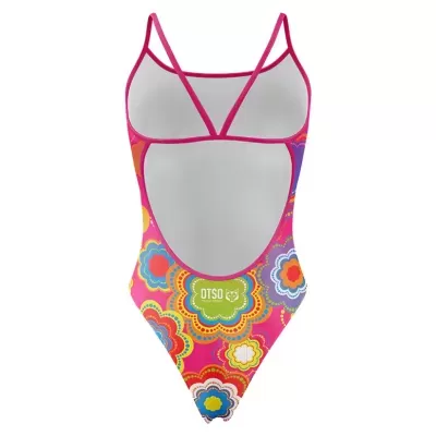 Fato de banho feminino colorido com padrão floral e tiras finas