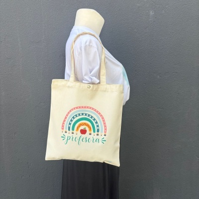 Saco tote bege com design colorido e texto profesora