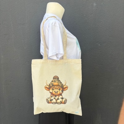 Saco de lona bege com ilustração de bezerro com gorro castanho
