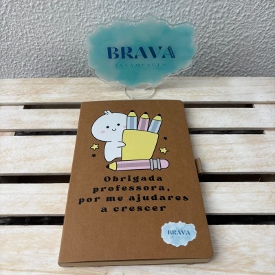 Caderno com desenho de personagem e texto de agradecimento para professora