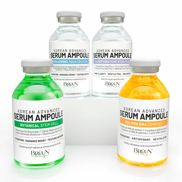 Kit 4 Séruns Booster Microagulhamento Rosto e Corpo com ou sem Dermapen Quatro frascos coloridos de séruns Korean Advanced Serum Ampoule com rótulos distintos e tampas metálicas.