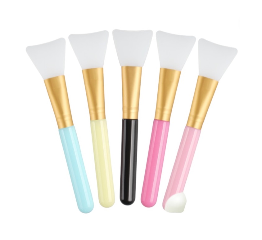 Kit 5 de Pincéis Máscara Facial de Silicone Cinco pincéis de silicone para máscaras faciais com cabos coloridos e ponteiras brancas.