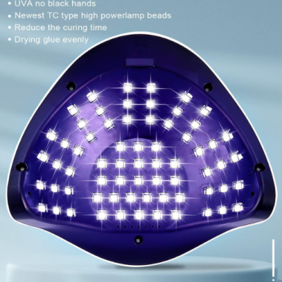 Lâmpada UV triangular roxa para unhas com LEDs acesos e texto explicativo em inglês