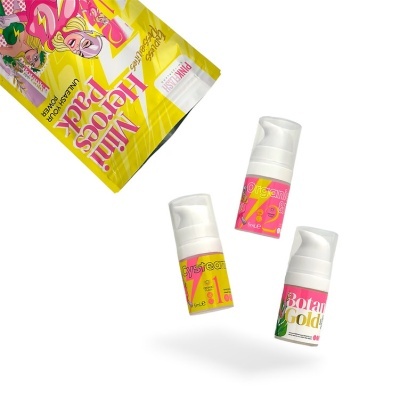 Pacote amarelo com três frascos pequenos coloridos