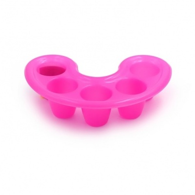 Palete de pintura de plástico rosa com compartimentos redondos.