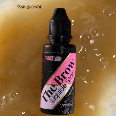 Frasco preto de corante líquido para sobrancelhas 'The Brow' da PINK FLASH com etiqueta rosa e roxa