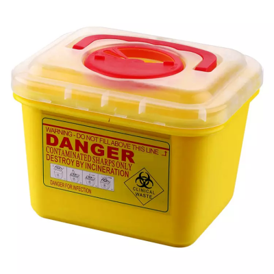 Recipiente amarelo para lixo clínico com tampa transparente e rótulos de aviso