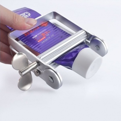 Dispositivo de metal espreme tubo de pasta dentífrica roxa