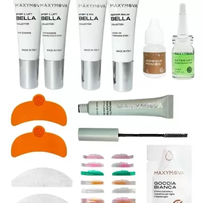 Produtos MAXYMOVA para pestanas e sobrancelhas com tubos, frascos, escova e acessórios coloridos