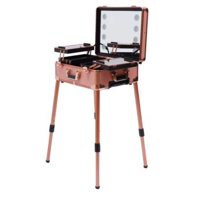 Estojo de maquilhagem metálico cor cobre com pernas e espelho