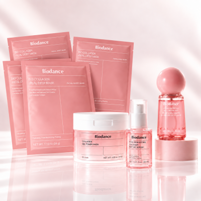 Produtos de cuidados faciais Biodance em embalagens rosa sobre superfície reflexiva
