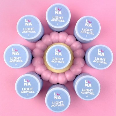 Conjunto de potes Light Acrygel LUNA numerados organizados em círculo sobre fundo rosa.