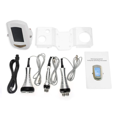 Equipamento estético multipolar com unidade principal, aplicadores, cabo USB, suporte e manual sobre fundo branco.