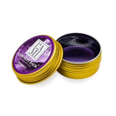 Recipiente dourado com cera de cabelo roxa e tampa roxa com texto TAMI HAIR GUM WAX POWERFUL
