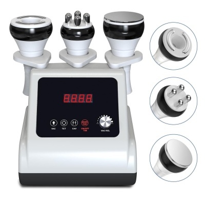 Aparelho eletrônico de estética com três aplicadores e painel digital.