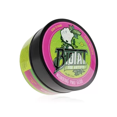 Pote preto com etiqueta rosa e verde Biotat for Artists Numbing Pain Glide