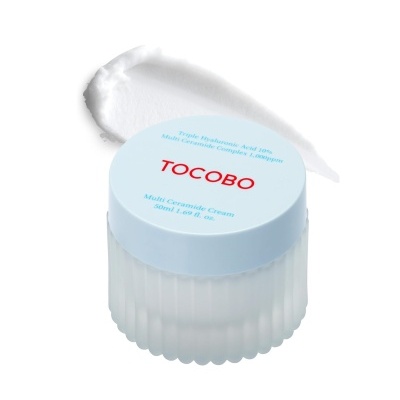 Frasco de creme facial TOCOBO com tampa azul clara e creme esbranquiçado aplicado ao lado
