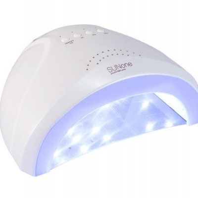 Aparelho de cura UV branco SUNone com luzes LED azuis acesas