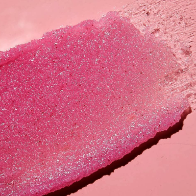 Amostra de maquiagem rosa cintilante com brilho em fundo rosa