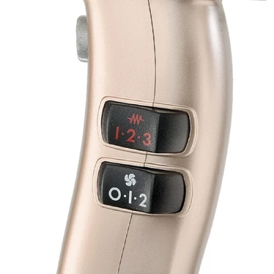 Dispositivo dourado com dois interruptores numerados e símbolos distintos