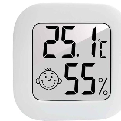 Termómetro digital branco com ecrã LCD a mostrar temperatura, humidade e ícone sorridente