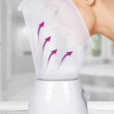 vaporizador facial branco com cúpula transparente e perfil de mulher