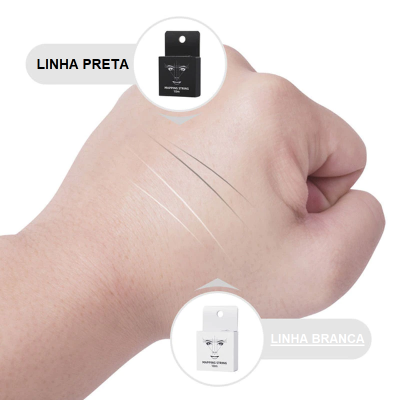 Traços preto e branco aplicados na pele da mão