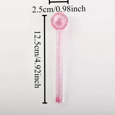 Colher medidora cor-de-rosa translúcido com brilho e dimensões indicadas