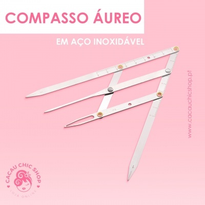 Compasso áureo em aço inoxidável prateado sobre fundo rosa com texto promocional e selo da loja