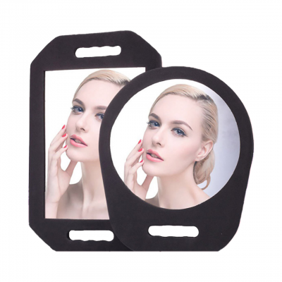 Dois espelhos portáteis com moldura preta e alça recortada, um retangular e outro redondo