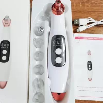 Dispositivo eletrónico branco e rosa com acessórios e manual numa caixa