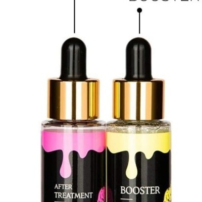 Dois frascos de vidro com líquidos rosa e amarelo para tratamento de lábios