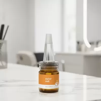 Frasco pequeno de vidro âmbar com rótulo orange e tampa transparente