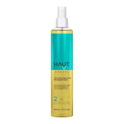 Frasco spray amarelo com rótulo azul e amarelo e texto HAUT MEDICAL